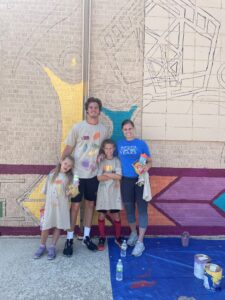 NIACC Volunteers paint mural