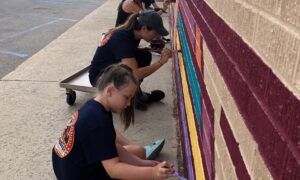 NIACC Volunteers painting mural