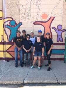 NIACC Volunteers paint mural
