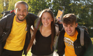 Three smiling students