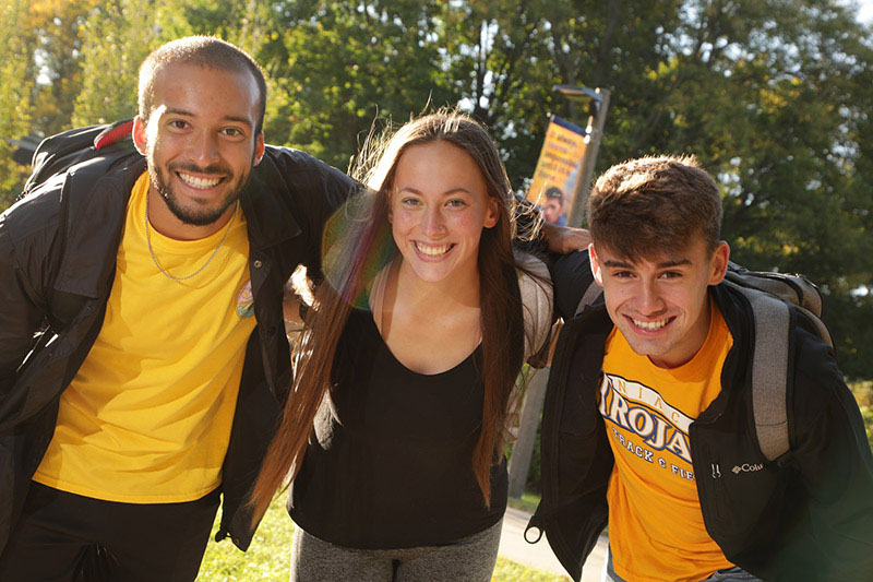 Three smiling students