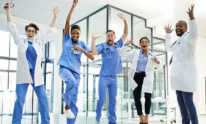 Healthcare staff jumping excitedly