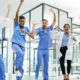 Healthcare staff jumping excitedly