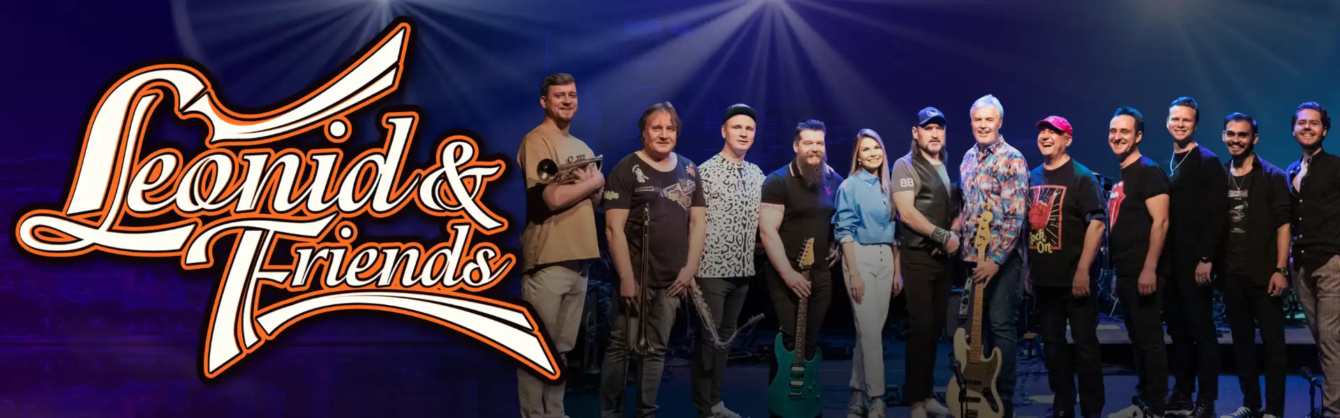 Promotional image for 'Leonid & Friends,' featuring the band members standing together on stage with their instruments under stage lights, with the band name in stylized text on the left side.