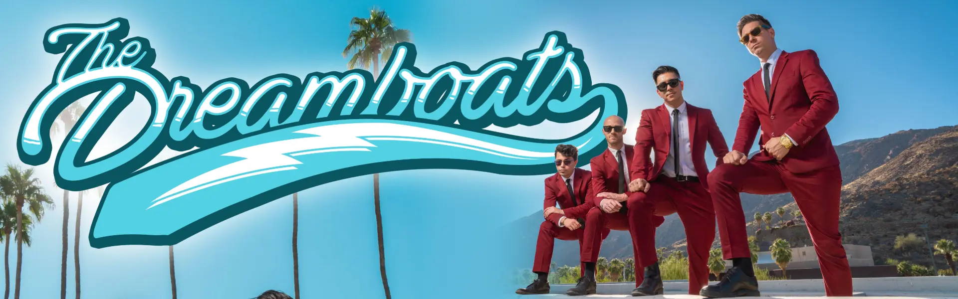 The Dreamboats promotional image featuring band members in matching red suits outdoors.