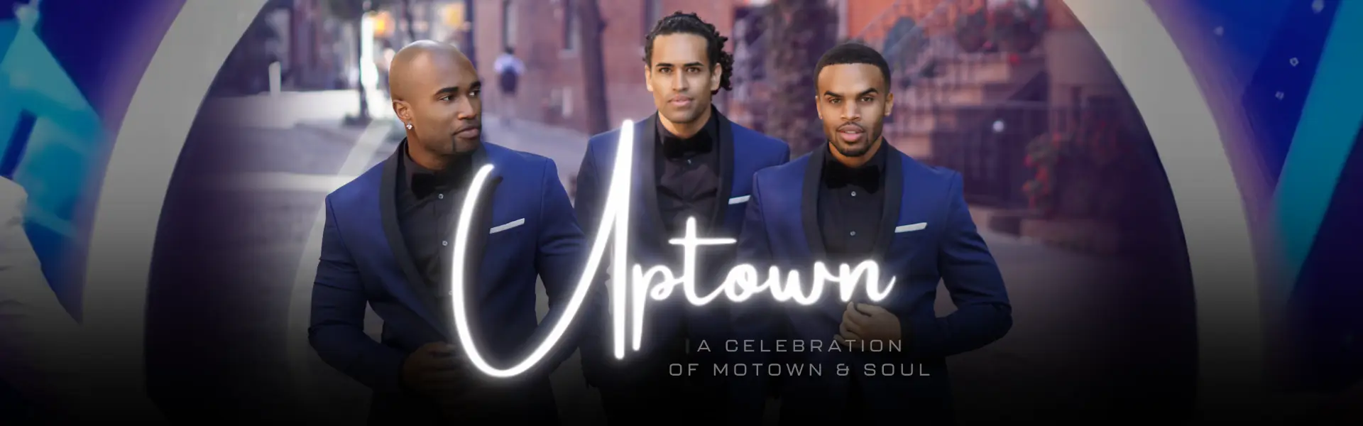 Promotional image for Uptown: A Celebration of Motown & Soul featuring three male vocalists in blue suits.