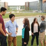 Picture of students standing next to NIACC pond