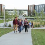 Picture of students walking from housing complex
