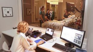 Photo of nursing students practicing in the Health Simulation Center