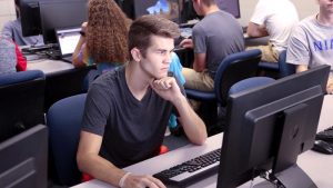 Photo students in a computer lab in McAllister Hall
