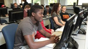 Photo students in a computer lab in McAllister Hall
