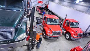 Photo of students working on trucks in the Diesel Technology Center