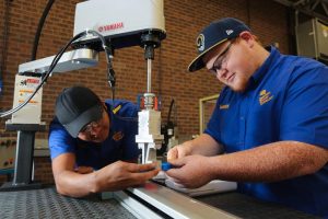 Picture of students working with robotics