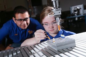 Picture of students working with robotics