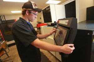 Picture of Tool & Die student using machinery