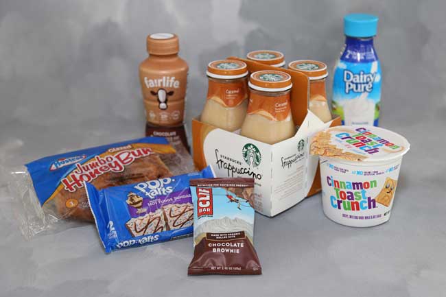 Picture of various breakfast food and drink items including Chocolate Milk, Frappuccino, Milk, Cereal, CLIF Bar, Pop Tarts, and Honey Bun
