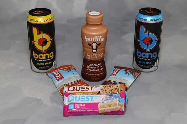Picture of various snacks and drinks including Bang Energy Drink, Chocolate Milk, CLIF Bars, and Quest Bars