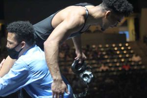 Picture of Wrestling Champion Christian Minto being carried