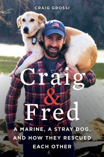 Book cover of a man (Craig) with his dog (Fred) slung over his shoulders