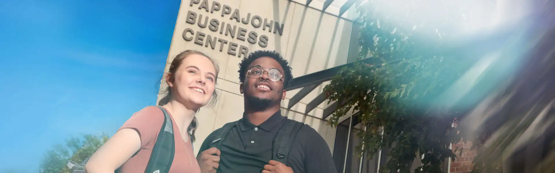 Photo of two students standing outside the Pappajohn Entrepreneurial Center