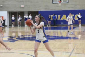 NIACC women’s basketball player in mid-play preparing to shoot the ball during a game.