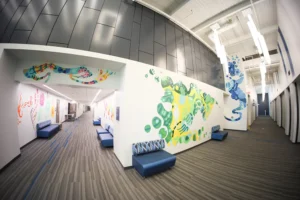 Colorful STEM hallway at NIACC with bright murals and modern lighting design.