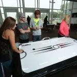 Picture of students playing air hockey