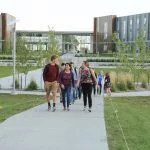 Picture of students walking from housing complex
