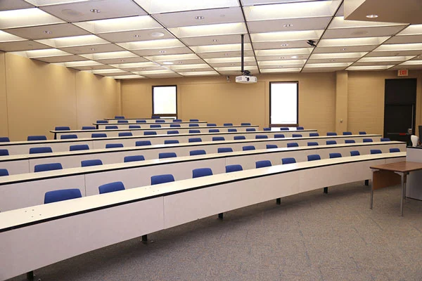 Photo of meeting room MH104G showing seating and desk layout