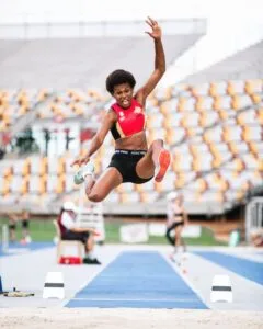 Picture of Rellie Kaputin in the middle of a Long Jump